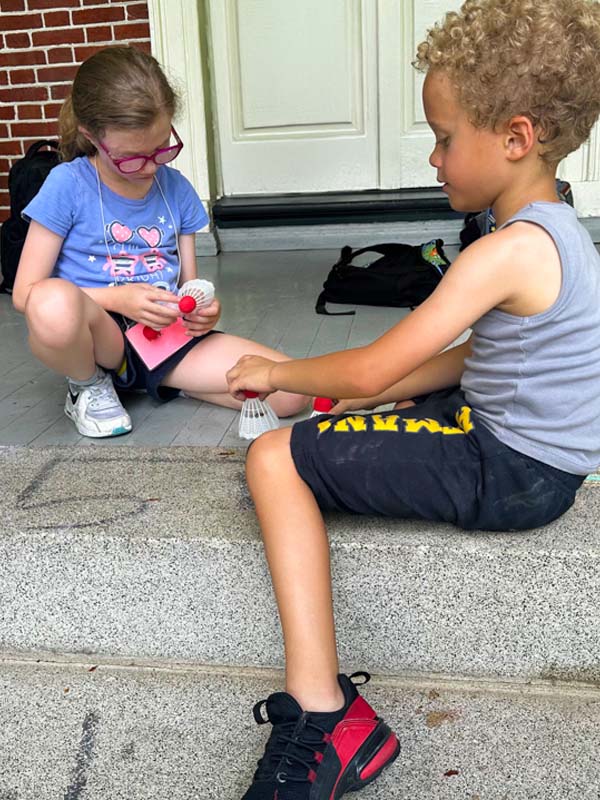 Kids practicing social skills together at summer camp